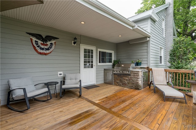 deck with area for grilling and a grill