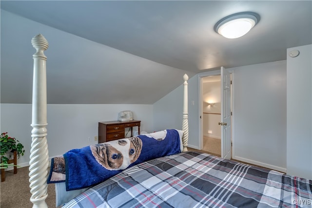 carpeted bedroom featuring vaulted ceiling