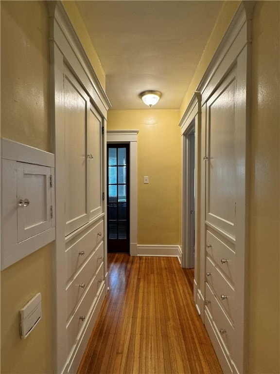 corridor with dark wood-type flooring