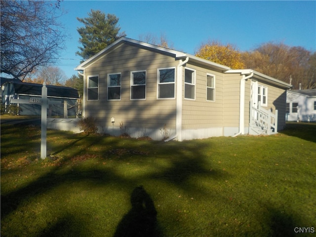 view of property exterior featuring a yard