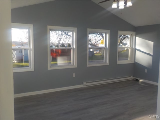 unfurnished room with ceiling fan, vaulted ceiling, dark hardwood / wood-style flooring, and a baseboard radiator