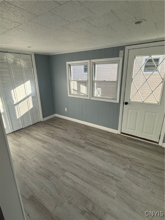 entryway with hardwood / wood-style floors