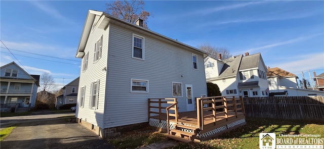 rear view of property with a deck