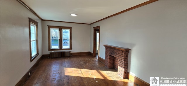 unfurnished living room with dark hardwood / wood-style floors, a fireplace, radiator heating unit, and ornamental molding