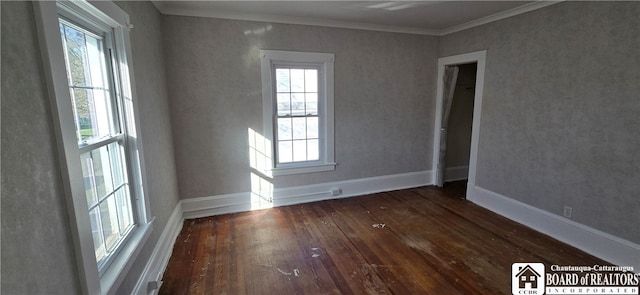 unfurnished room with crown molding and dark hardwood / wood-style flooring