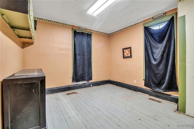 empty room featuring hardwood / wood-style flooring