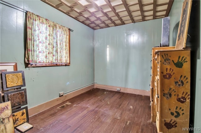 empty room with hardwood / wood-style flooring