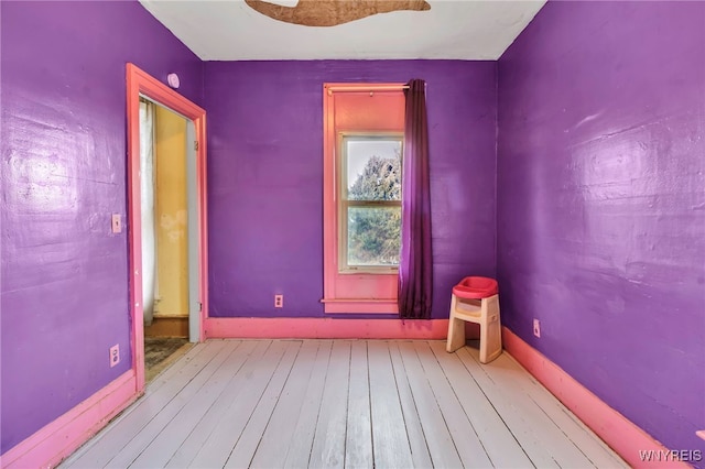 spare room with light hardwood / wood-style floors