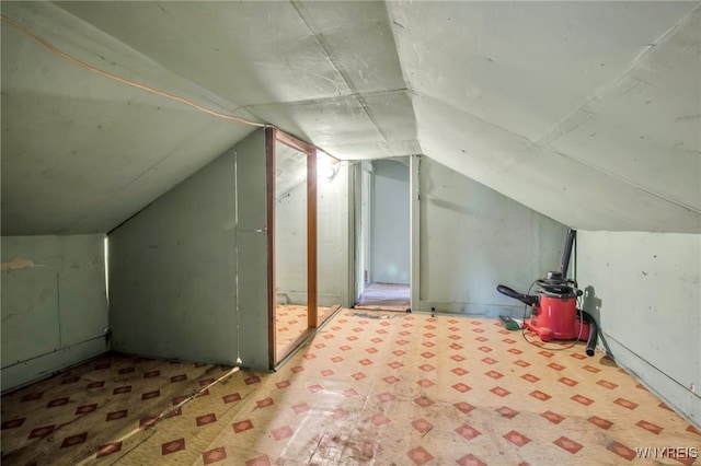 bonus room featuring vaulted ceiling