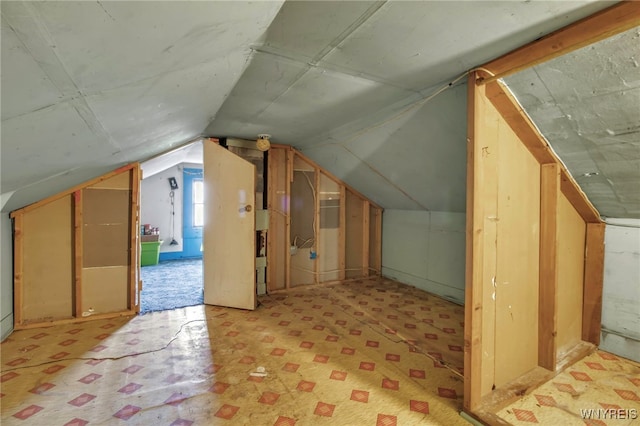 bonus room with vaulted ceiling