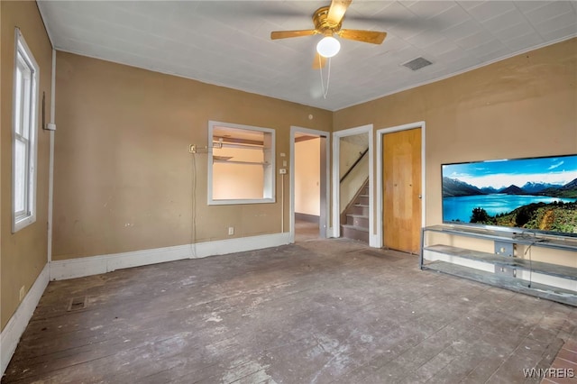 unfurnished living room featuring ceiling fan