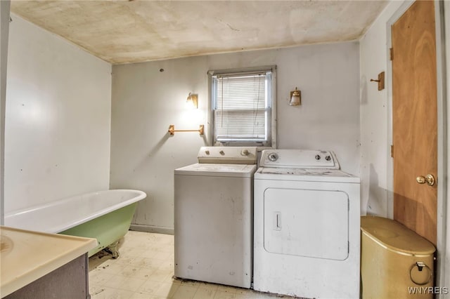 laundry area featuring washing machine and clothes dryer