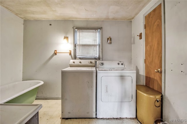 clothes washing area featuring independent washer and dryer