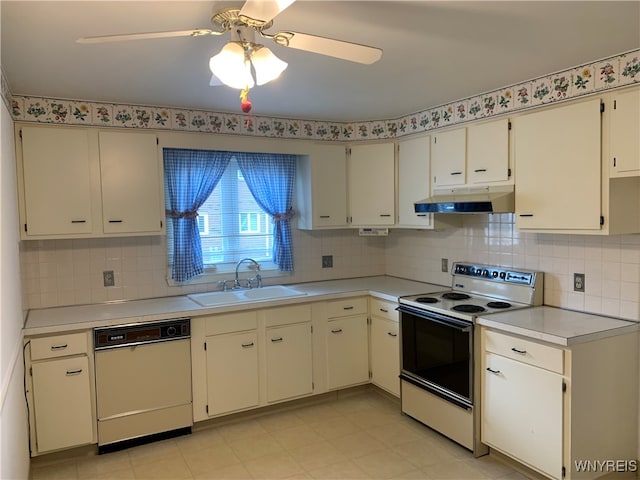 kitchen with white appliances, sink, ceiling fan, tasteful backsplash, and white cabinetry