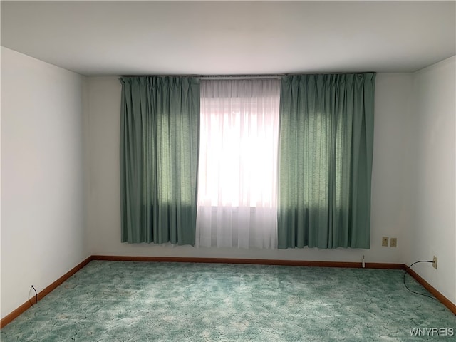 unfurnished room featuring carpet flooring