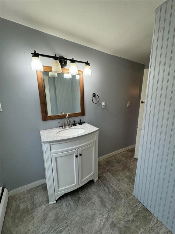 bathroom featuring vanity and a baseboard heating unit