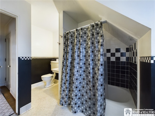 bathroom featuring tile patterned flooring and toilet