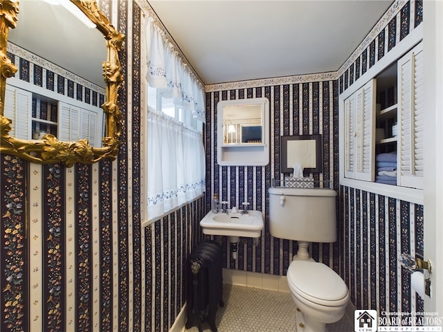 bathroom featuring tile patterned floors and toilet