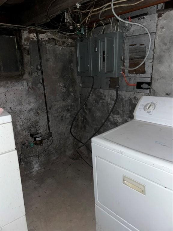 basement with electric panel and washer / clothes dryer