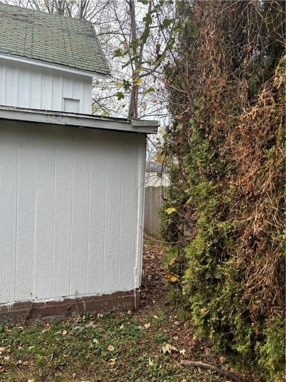 view of property exterior with a shed