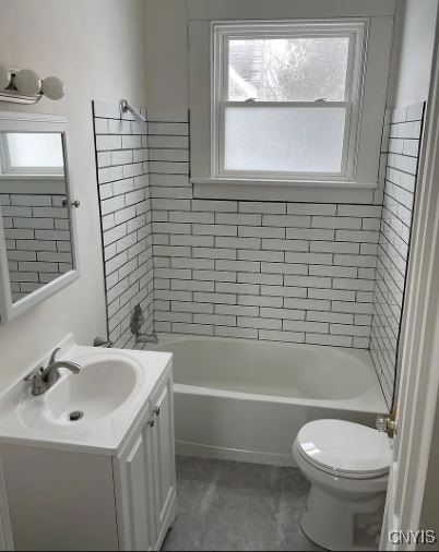 full bathroom featuring vanity, toilet, and tiled shower / bath