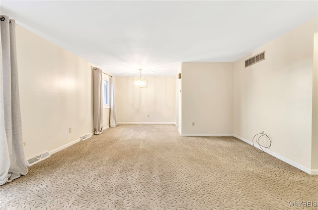 spare room with carpet flooring