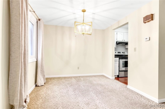 unfurnished dining area featuring carpet and a notable chandelier