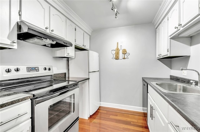 kitchen featuring white cabinets, light hardwood / wood-style floors, sink, and appliances with stainless steel finishes