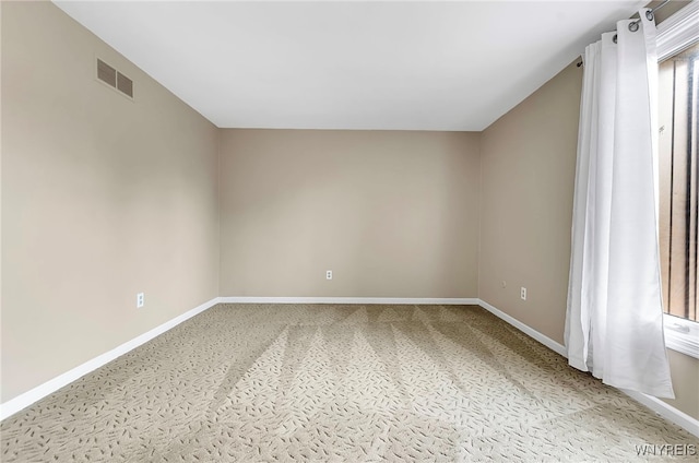 unfurnished room with carpet flooring