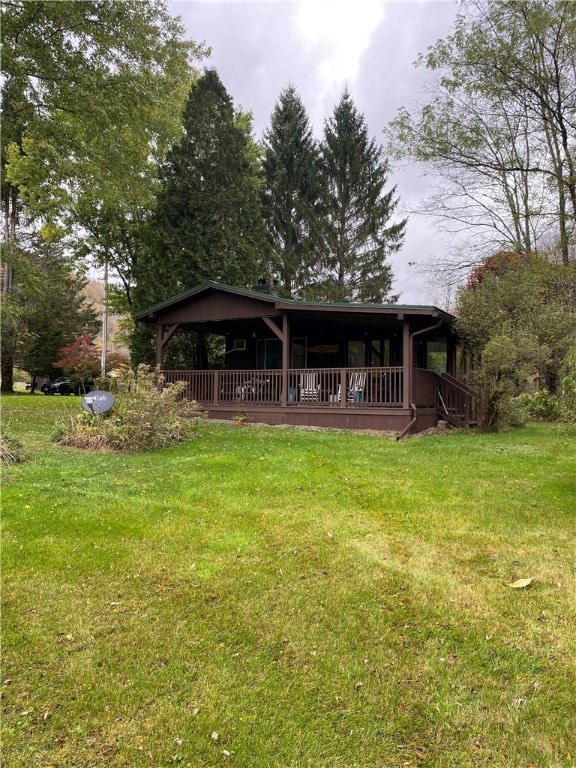 rear view of house with a yard