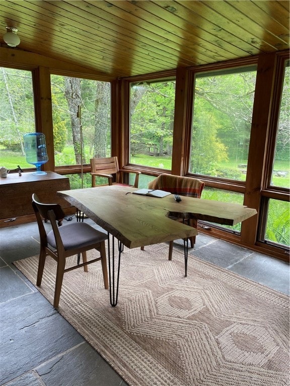 sunroom with wooden ceiling and vaulted ceiling