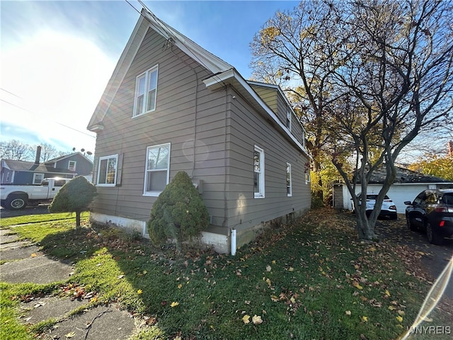 view of home's exterior featuring a yard