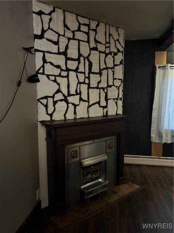 room details with wood-type flooring and a baseboard radiator