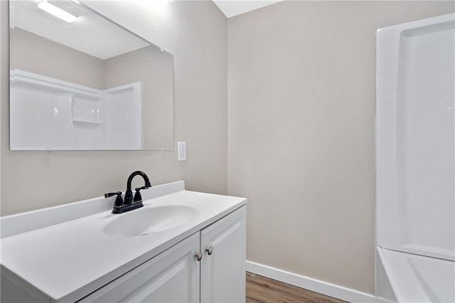 bathroom with vanity and wood-type flooring