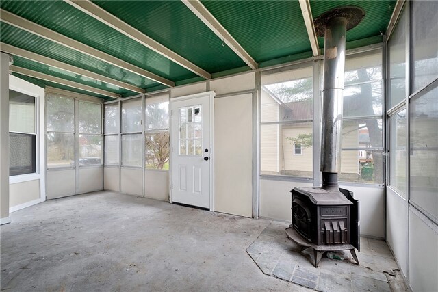 sunroom / solarium featuring a wood stove