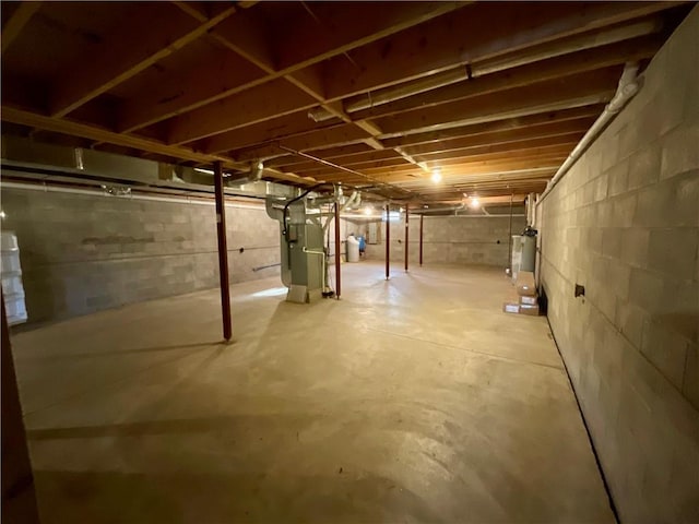 unfinished below grade area with water heater and heating unit