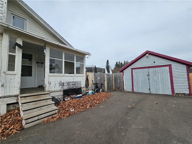 view of side of property with a storage unit