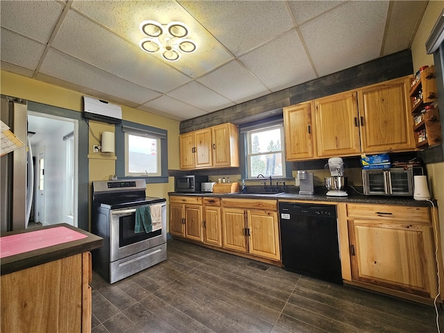 kitchen featuring a drop ceiling, dark wood-type flooring, stainless steel electric range, and black dishwasher