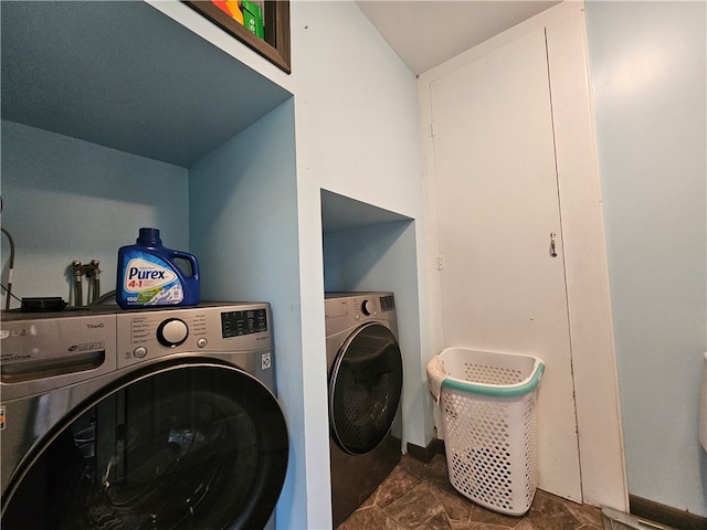 clothes washing area featuring washing machine and dryer