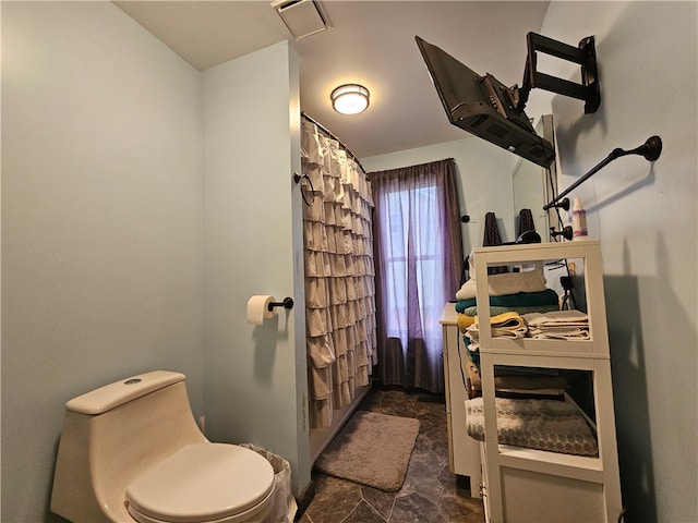 bathroom featuring toilet