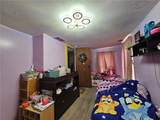 bedroom with wood-type flooring