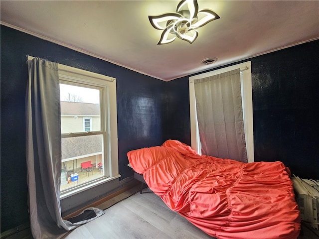 bedroom with hardwood / wood-style floors