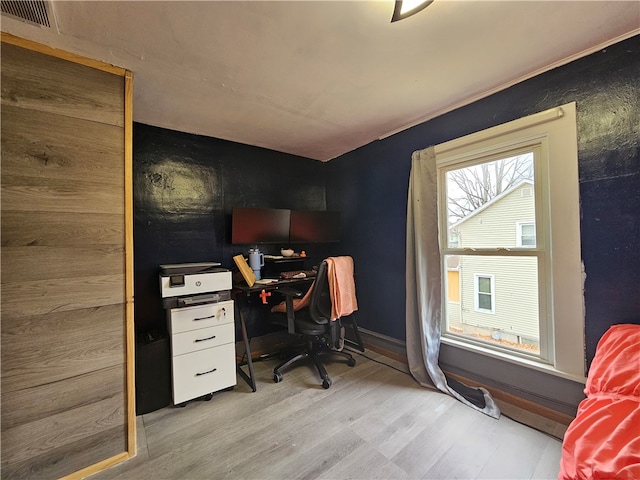 office with light hardwood / wood-style floors