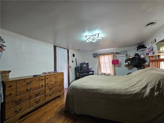 bedroom featuring dark hardwood / wood-style flooring