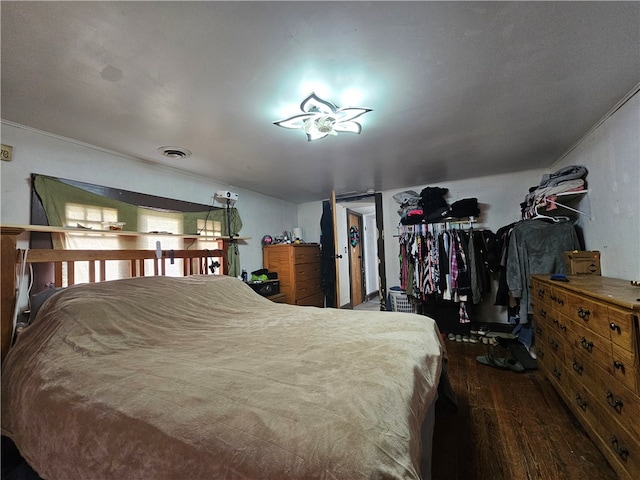 bedroom with hardwood / wood-style flooring