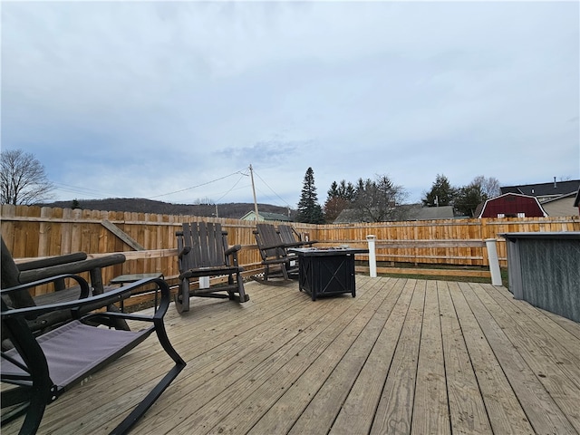 deck featuring an outdoor fire pit