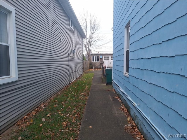 view of property exterior featuring fence