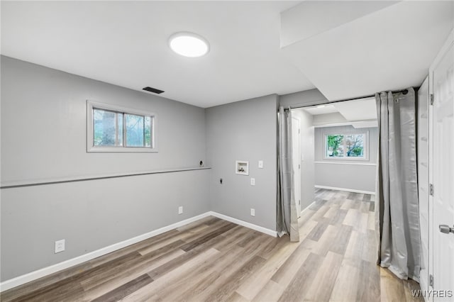 basement with light wood-type flooring