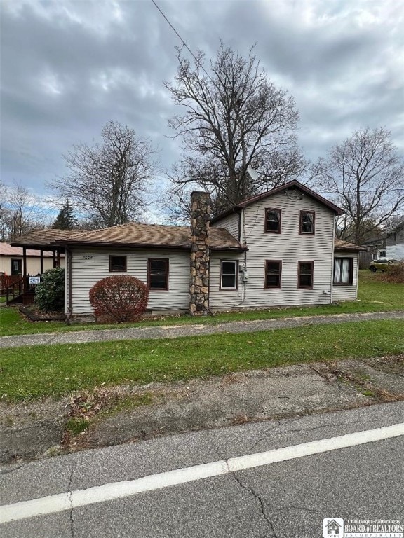 9604 Porter Rd, Pomfret, NY 14063 - traditional-style home featuring a chimney and a front yard