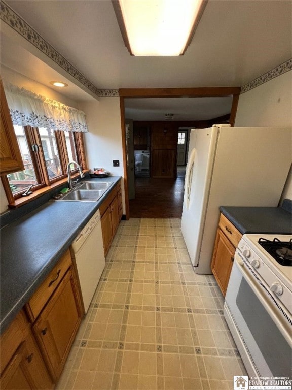 kitchen with white appliances and sink